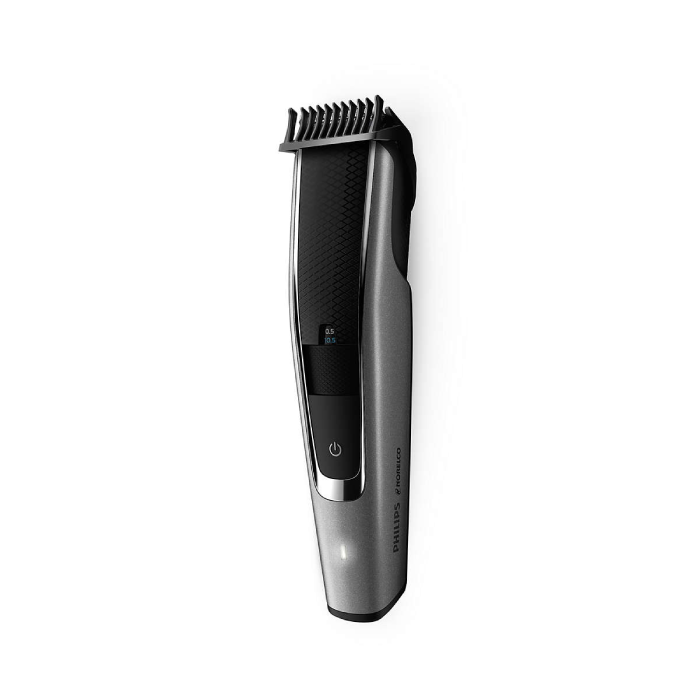 A close up of a hair trimmer on a white background