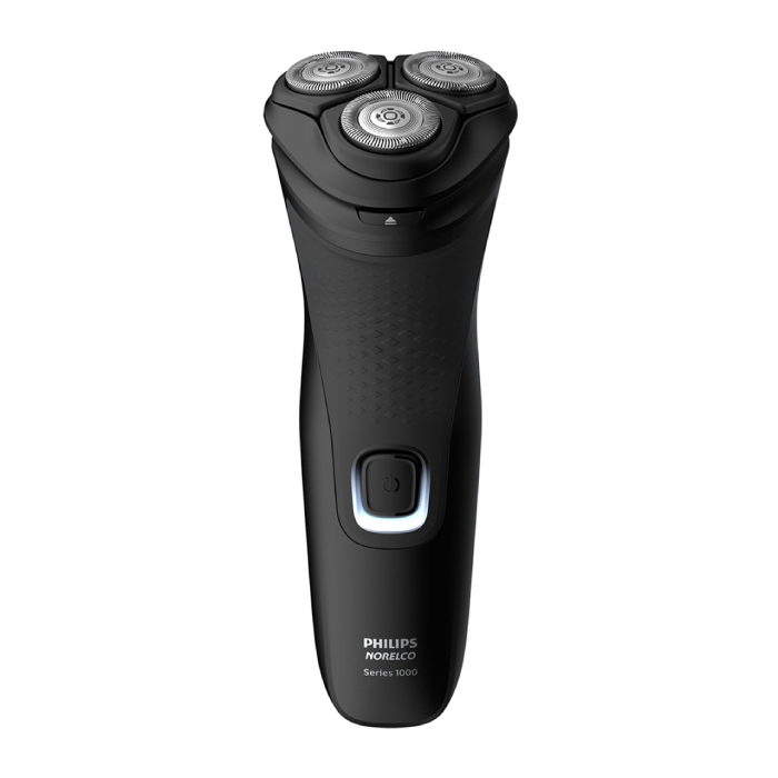 A black electric shaver with three blades.
