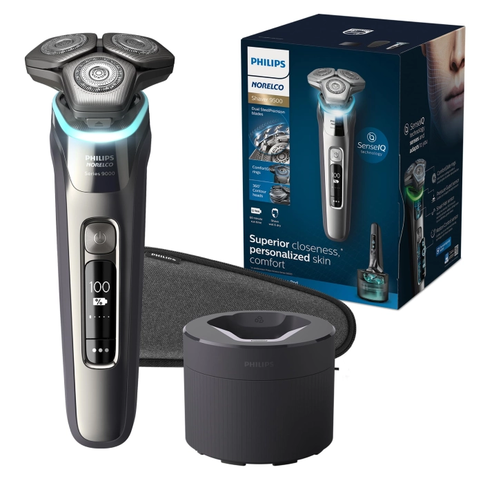 A silver and black electric razor with box