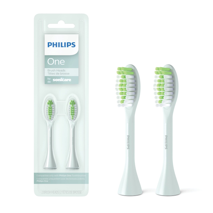 A pair of white toothbrush heads in packaging.