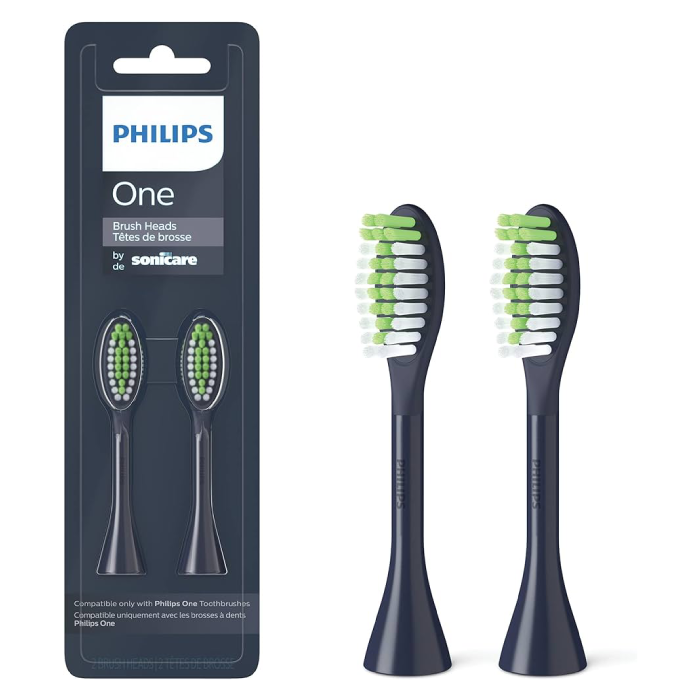 A pair of black and green toothbrush heads in packaging.