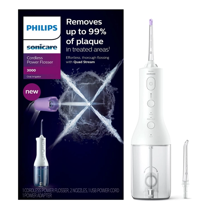 A white philips sonicare electric toothbrush next to its box.