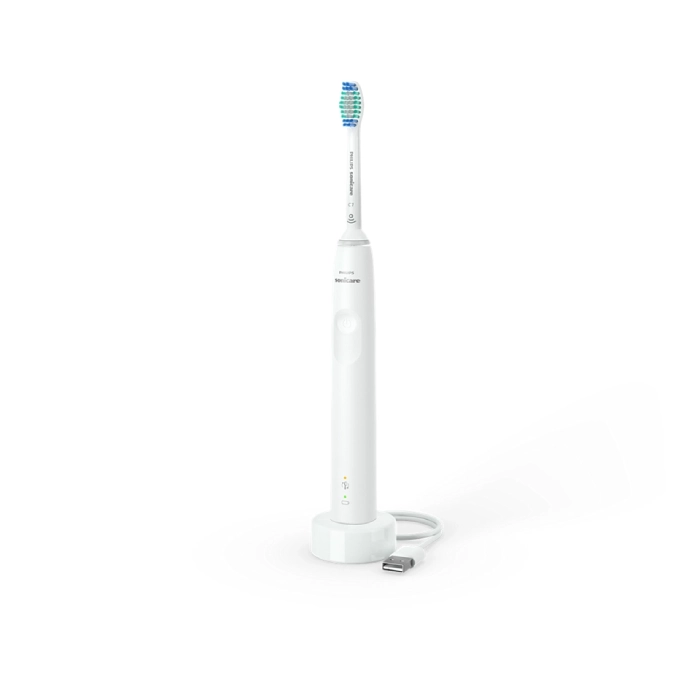 A white electric toothbrush with blue tooth brush.