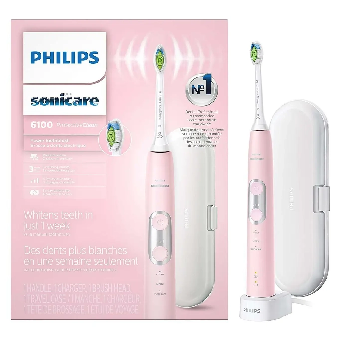 A pink electric toothbrush with its box.