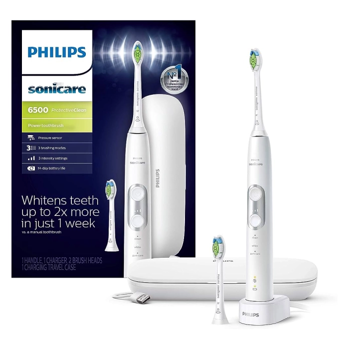 A white philips sonicare electric toothbrush next to another one.