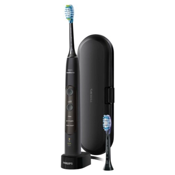 A black electric toothbrush and case on a white background