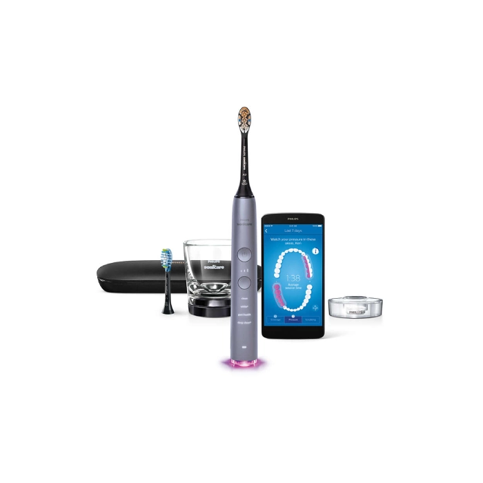 A smart phone and an electric toothbrush are next to each other.