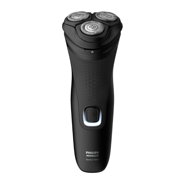 A black electric shaver with three blades.