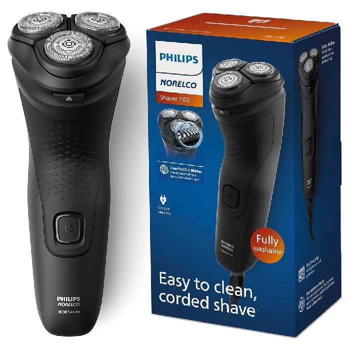 A black electric shaver with box and instructions.
