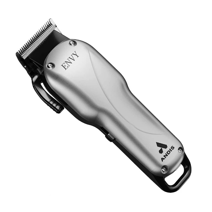 A silver hair clipper is sitting on top of the floor.