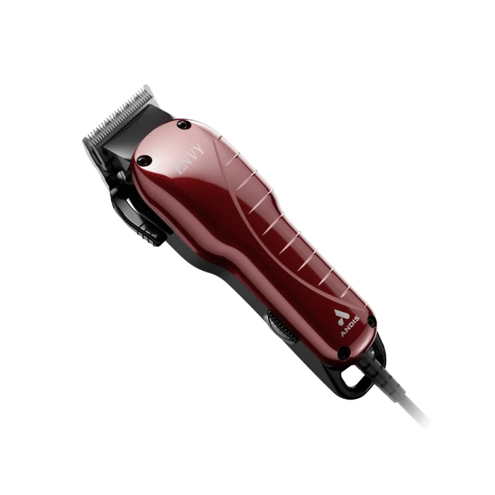 A red hair clipper is sitting on the floor.