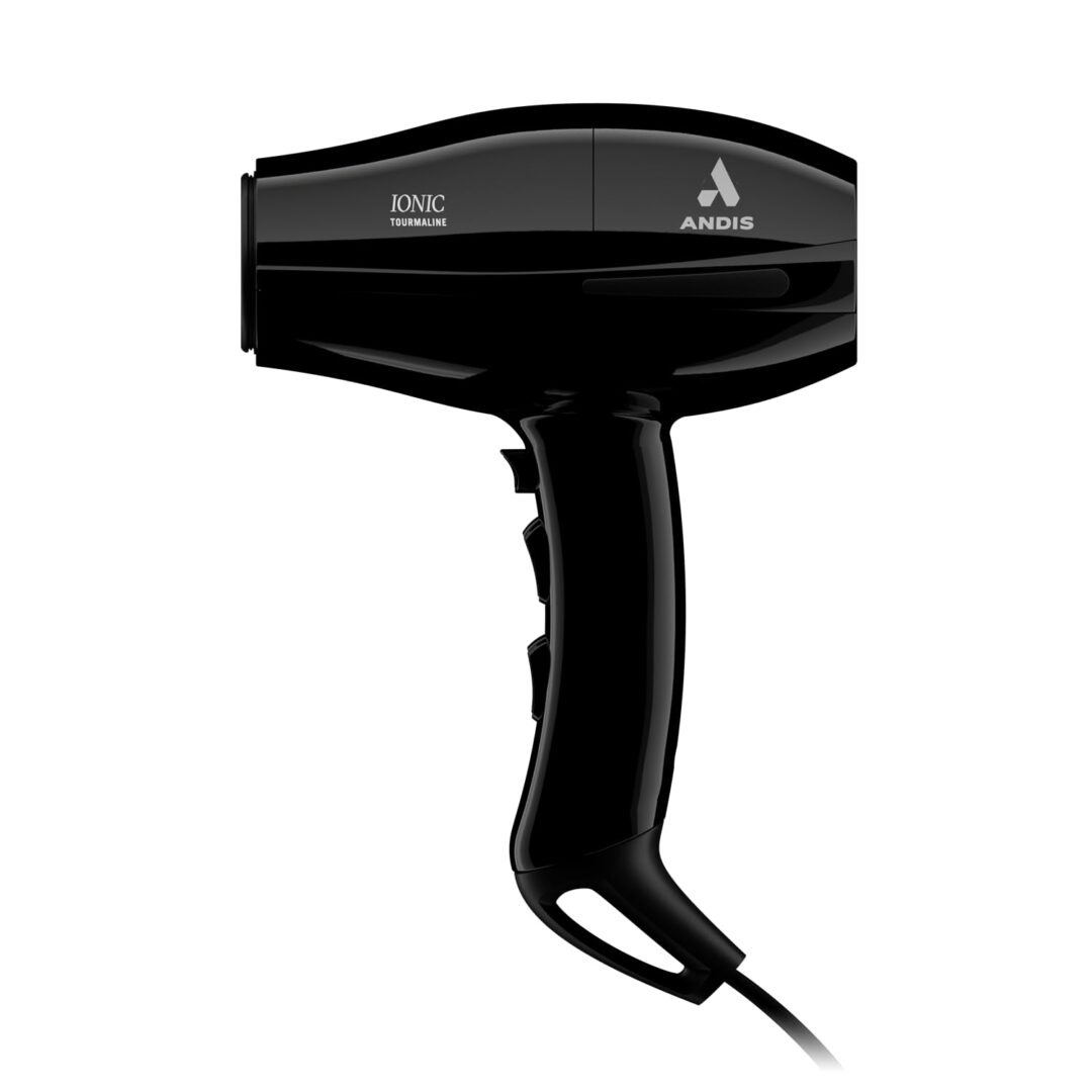 A black hair dryer with its cord plugged in.
