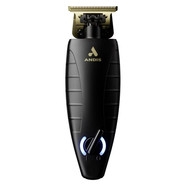 A black and gold trimmer is sitting on the floor.