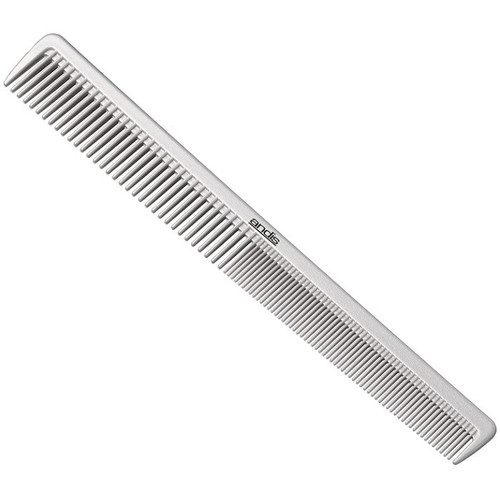 A white comb is laying on the floor