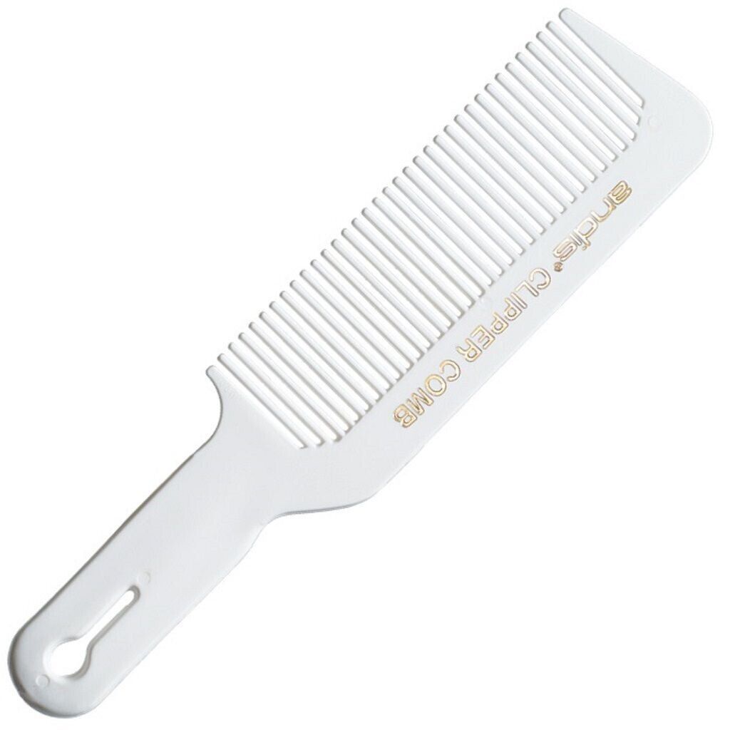 A white comb with gold lettering on it.